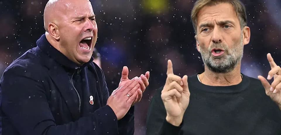Two football managers discussing during a match