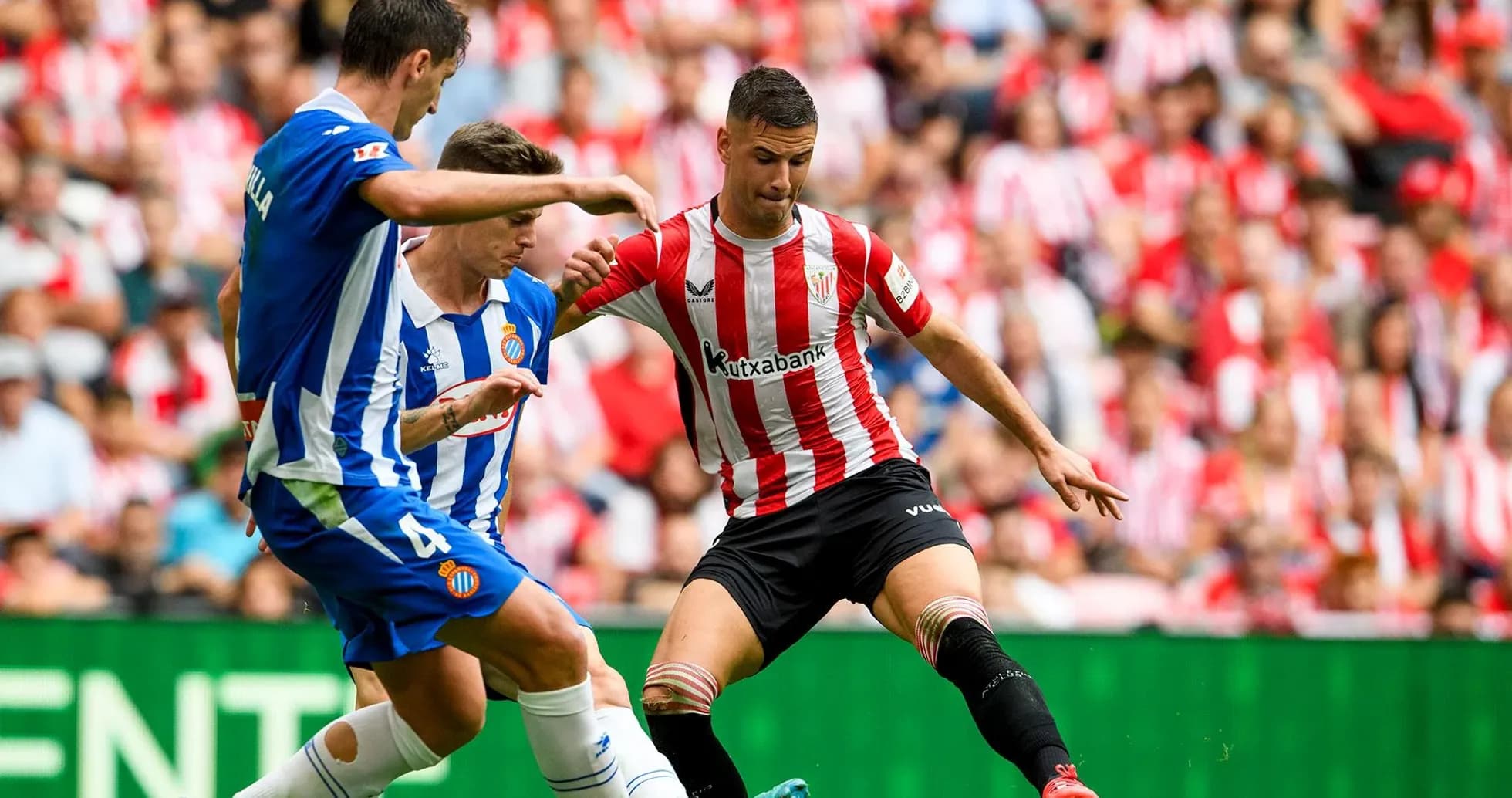 Espanyol and Athletic Club players competing for the ball