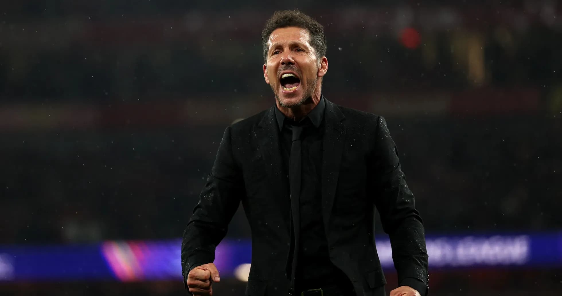 Manager celebrating passionately during a match