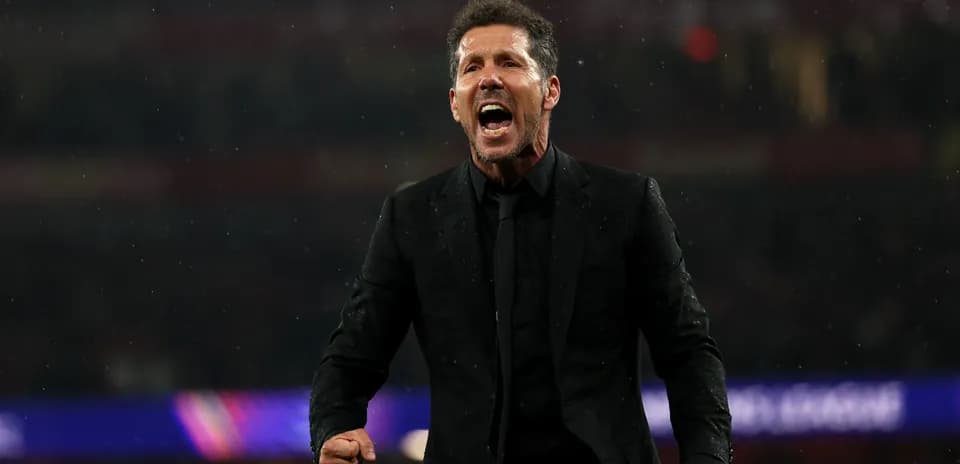 Manager celebrating passionately during a match