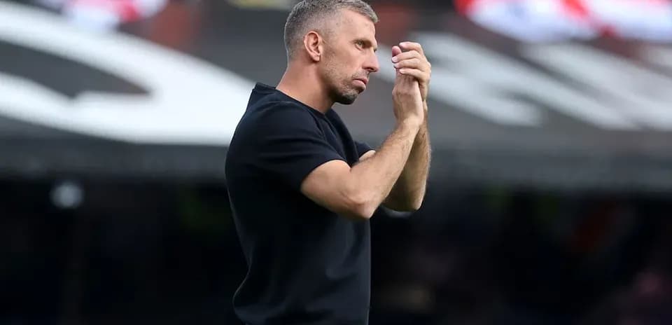 Coach gesturing during a match on the sideline