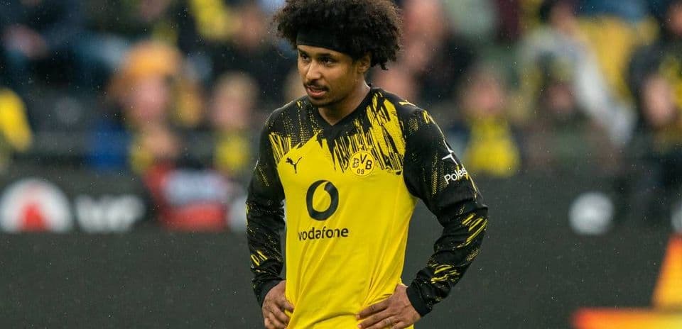 Player wearing Borussia Dortmund jersey on the field