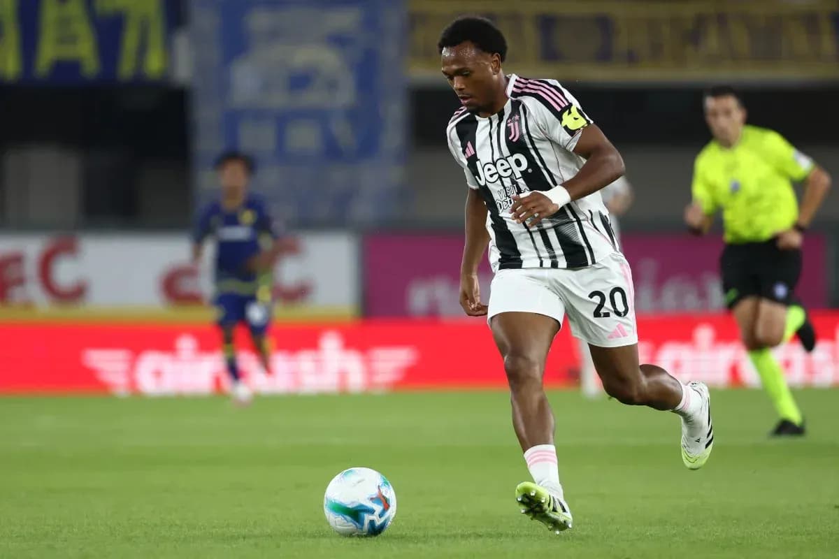 Juventus player running with ball during match