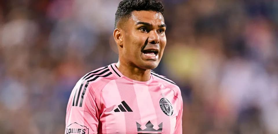 Player in pink jersey arguing during match