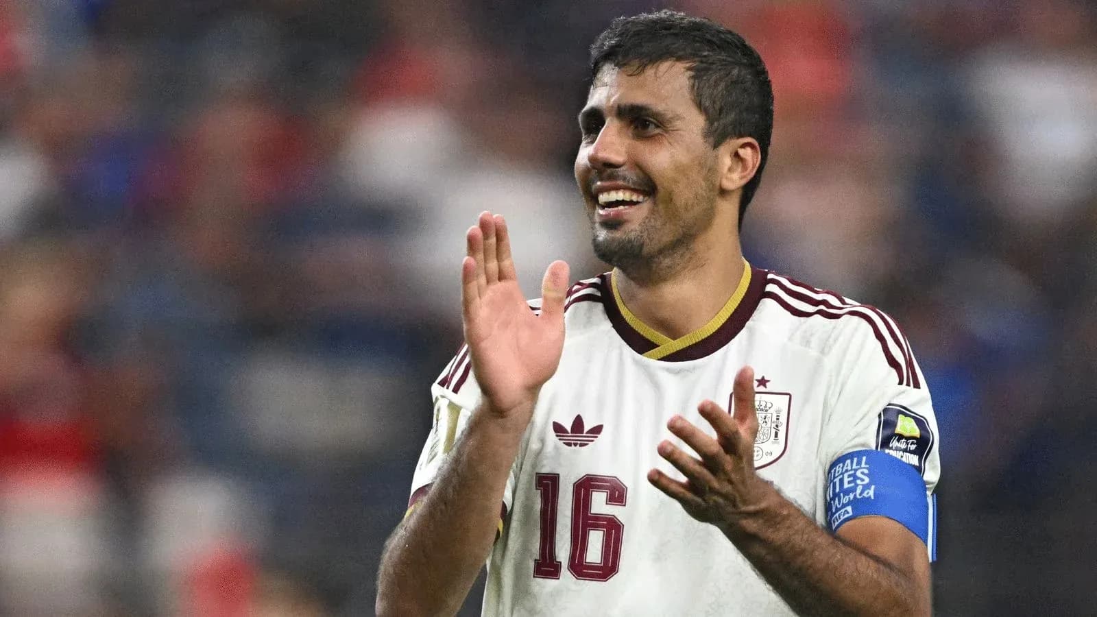 Player celebrating with applause during a match