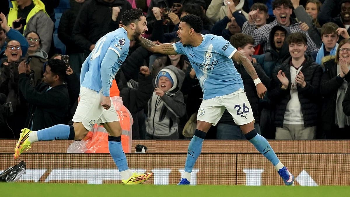 Manchester City players celebrating a goal