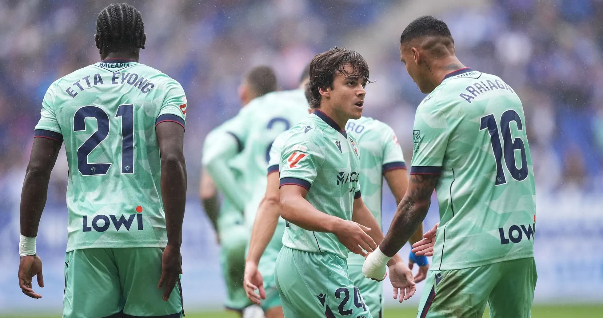 Levante players discussing strategy during match