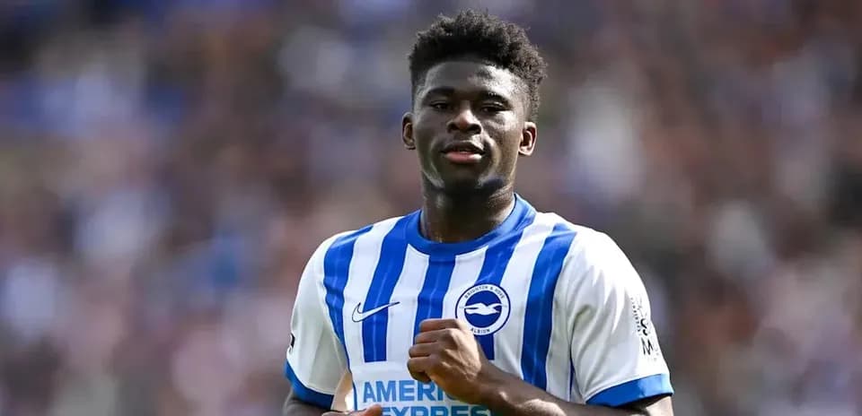 Player in Brighton & Hove Albion jersey on pitch