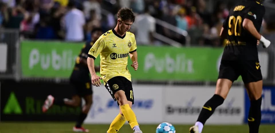 Player dribbling the ball during USL match