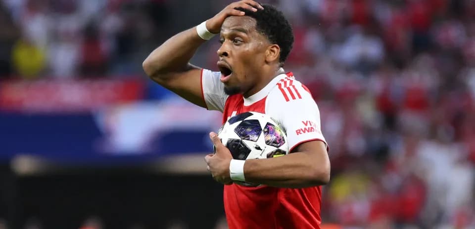 Player holding ball with surprised expression during match