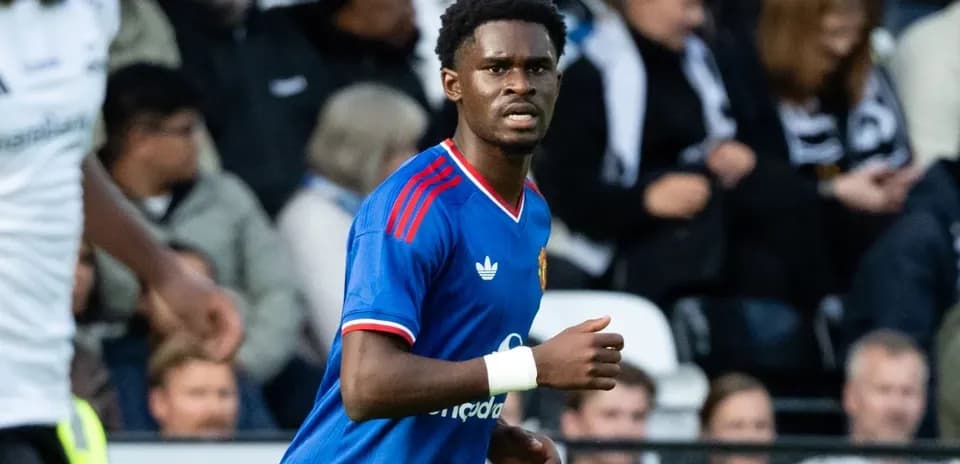Player in blue jersey during football match