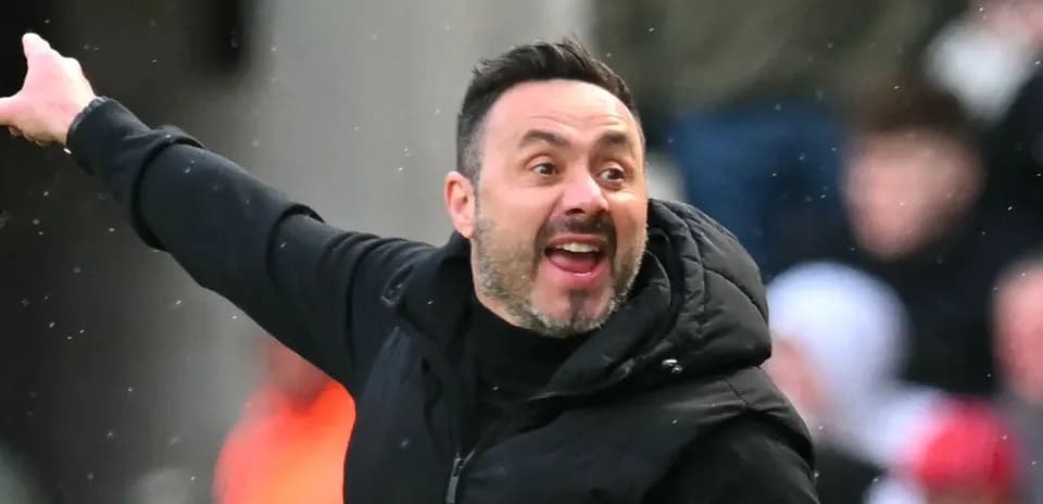 Coach gesturing passionately during a match