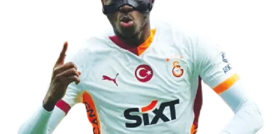 Player celebrating in Galatasaray jersey with mask
