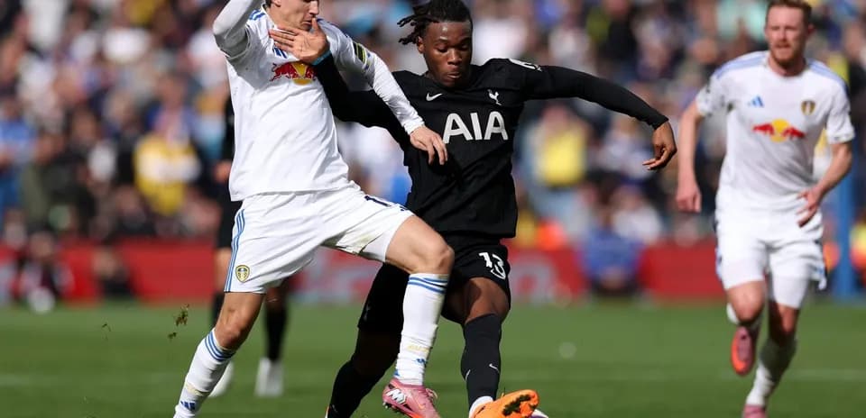 Player tackles opponent during Tottenham vs Leeds match