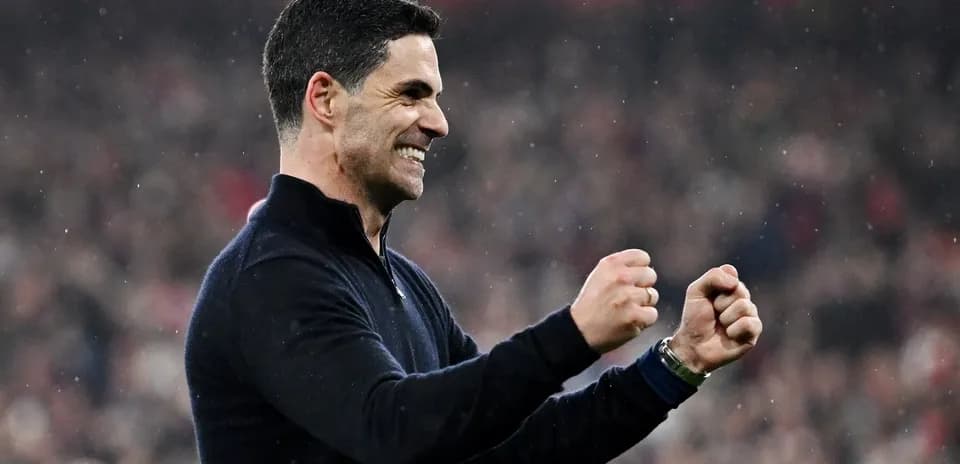 Coach celebrating with clenched fists during match