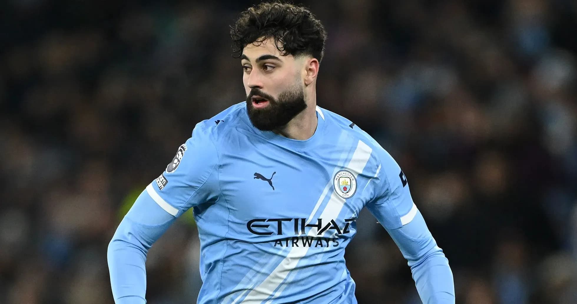 Player in light blue Manchester City kit during match