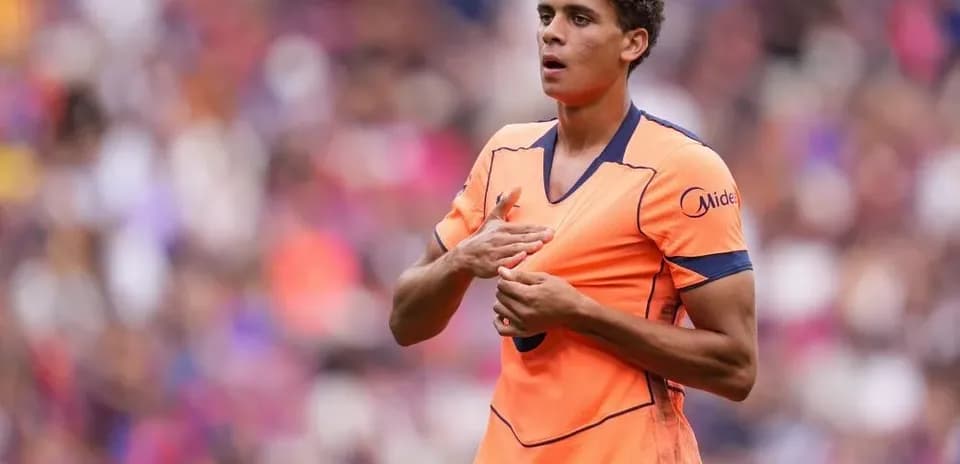 Player adjusting shirt during match at stadium