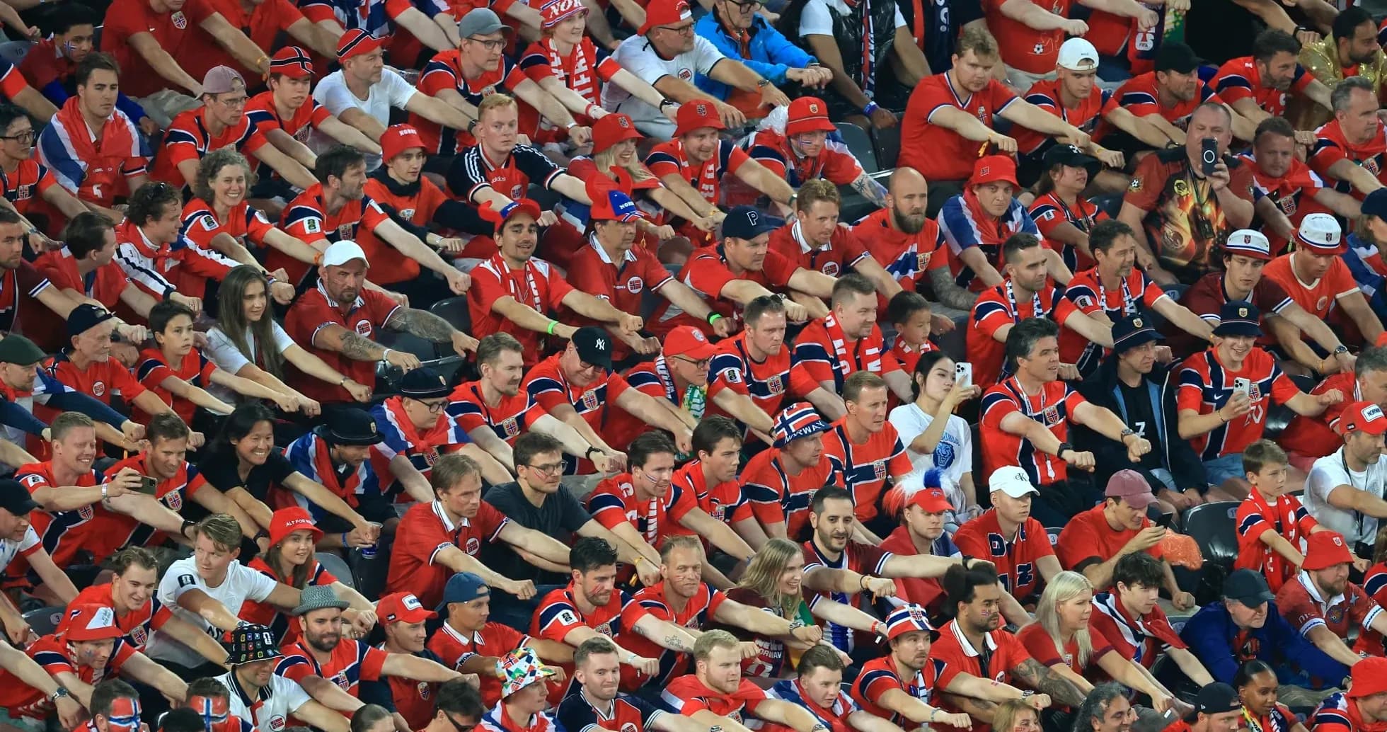Crowd of fans in red shirts at event