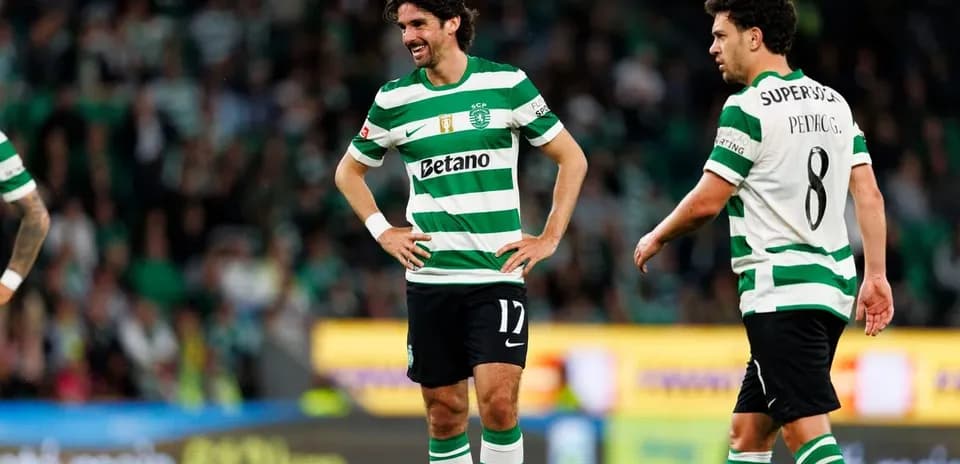 Two Sporting CP players on the pitch during match