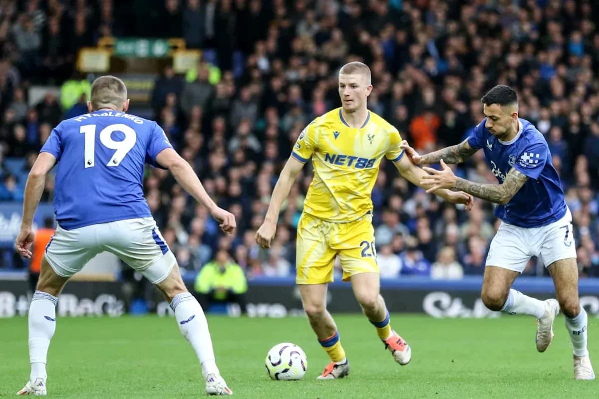 Players contesting possession during football match