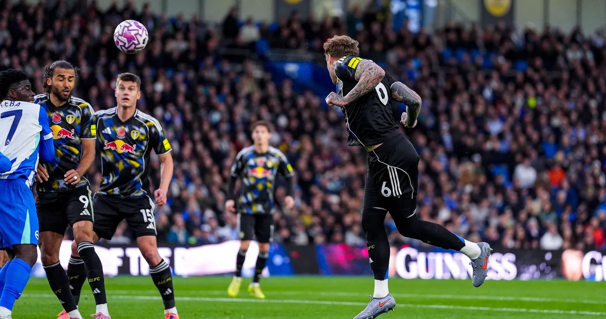 Leeds player heading the ball during match
