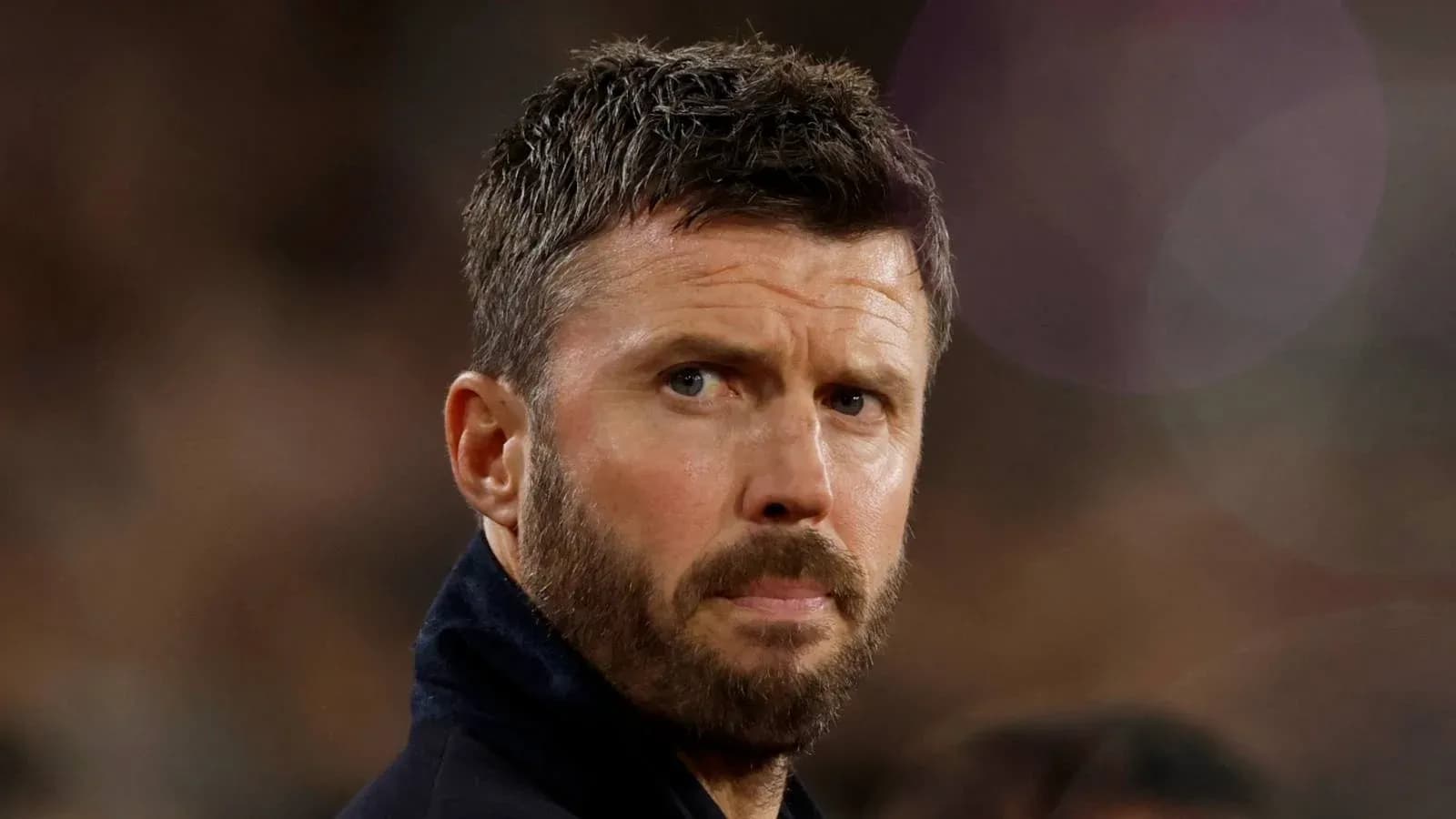 Coach observing the match from the sidelines