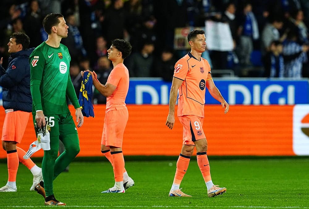 Barcelona players leaving the pitch after match