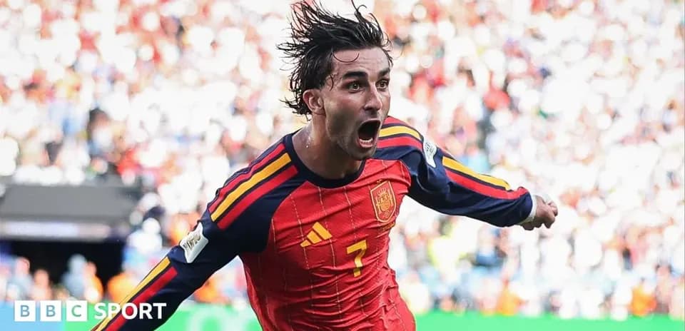 Player celebrating a goal in Spain national team jersey