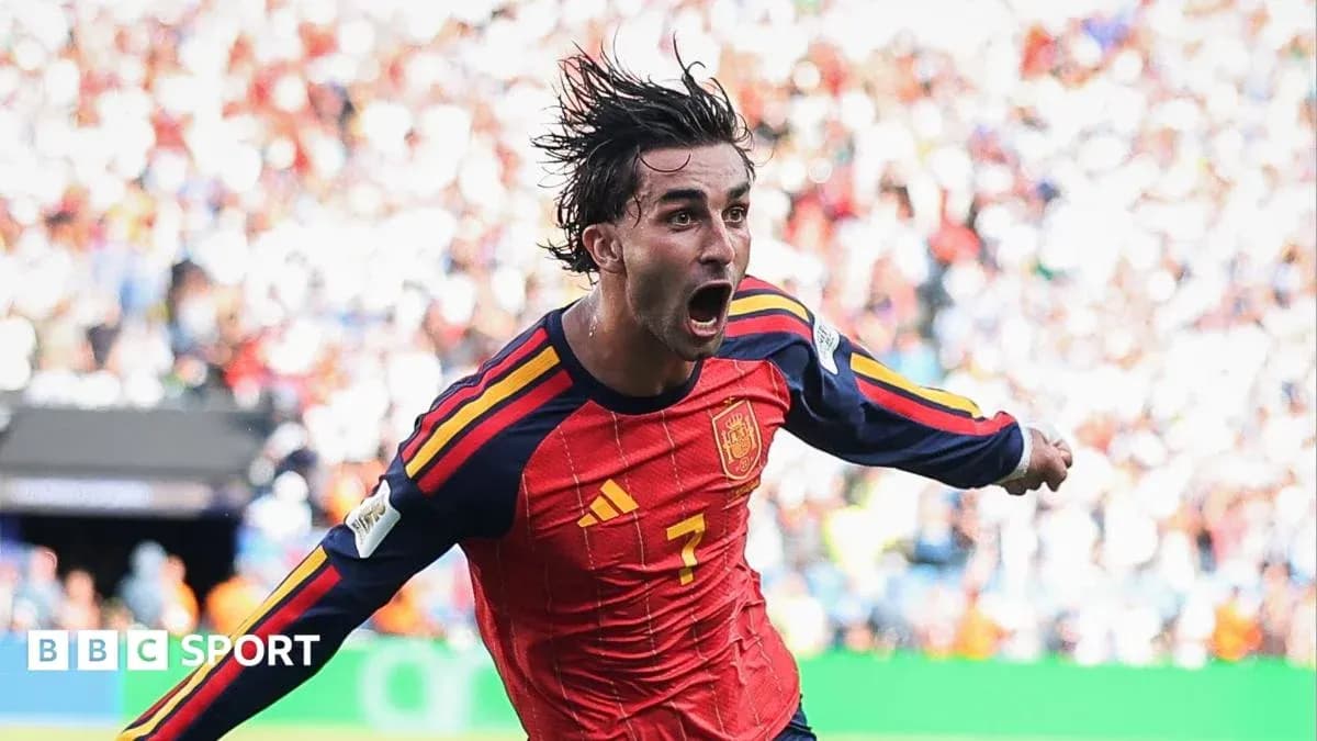 Player celebrating a goal in Spain national team jersey
