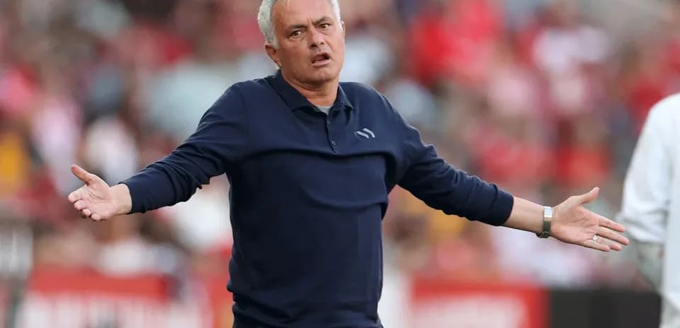 Coach gesturing during a match on the sideline