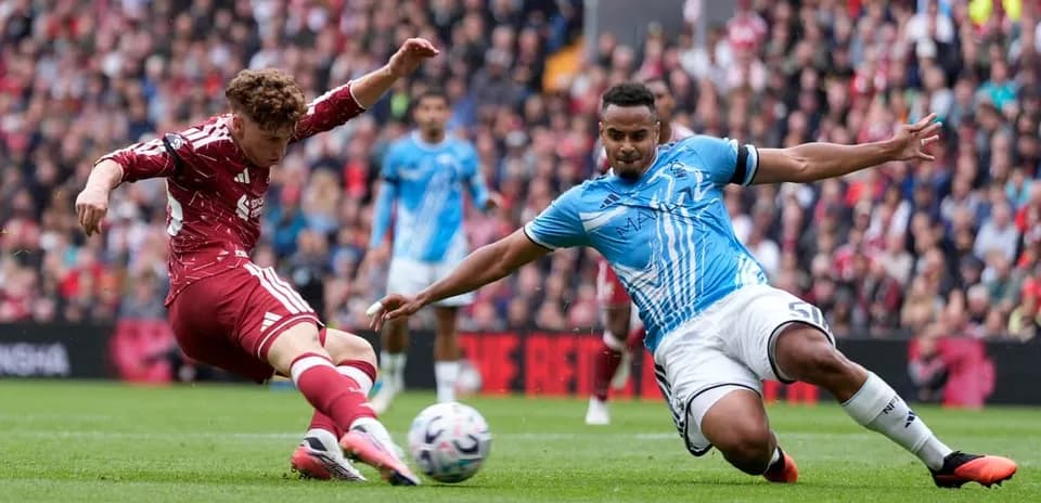 Player sliding to tackle another during match