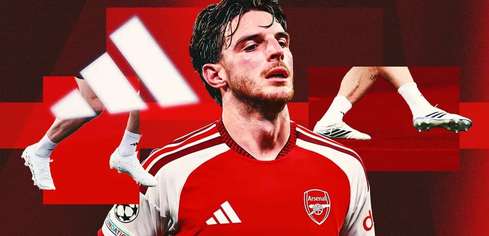 Arsenal player wearing red kit with Adidas branding