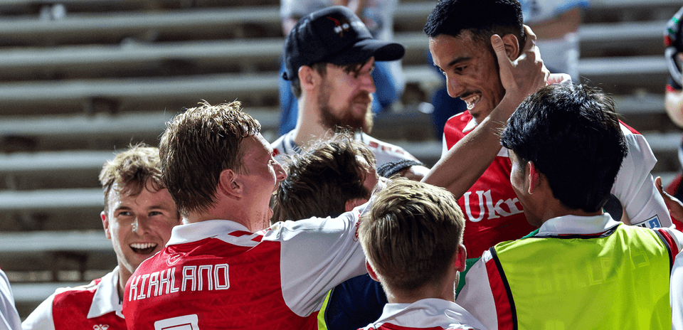 Players celebrating a goal during match