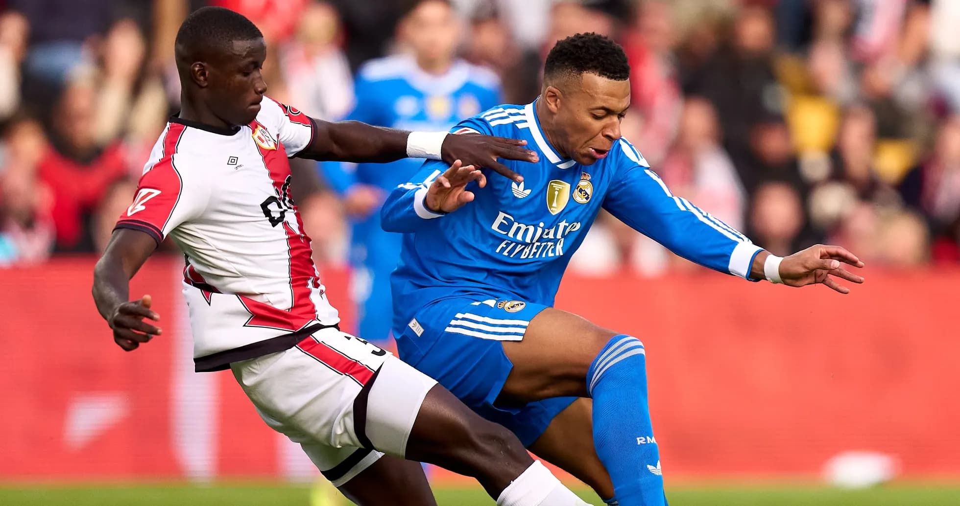 Player tackling opponent during football match action