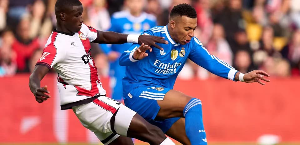 Player tackling opponent during football match action