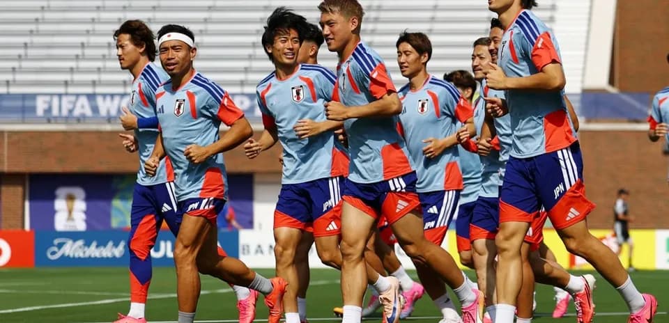 Japan national team players jogging during training session