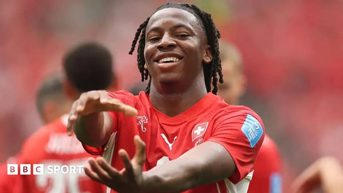 Player celebrating during a match in red jersey