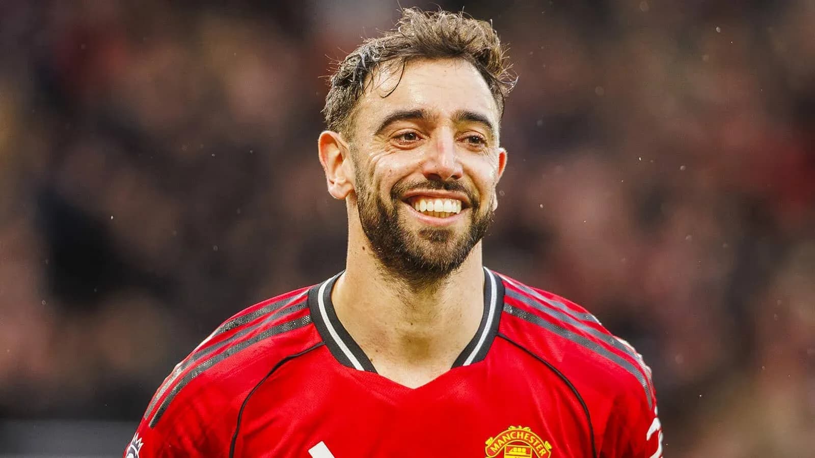 Bruno Fernandes smiling in Manchester United jersey