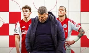 Ajax coach with two players in red jerseys