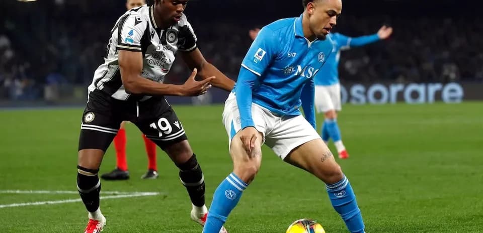 Napoli player challenged by Udinese opponent