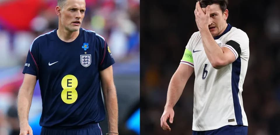 Two football players in England kits on the field