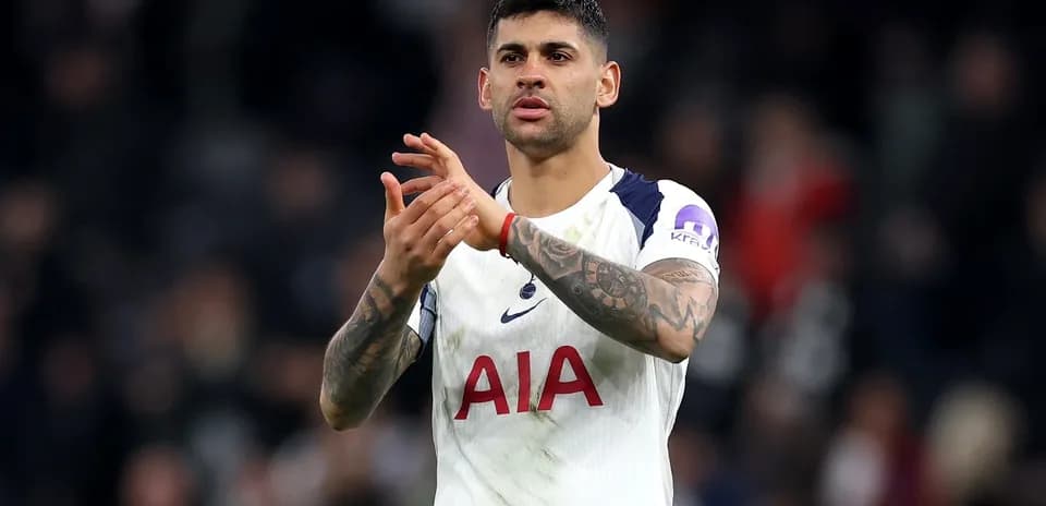 Player applauding fans after a match