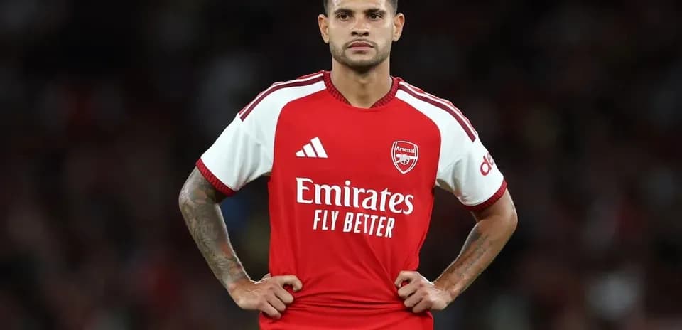 Player in Arsenal kit standing on the field