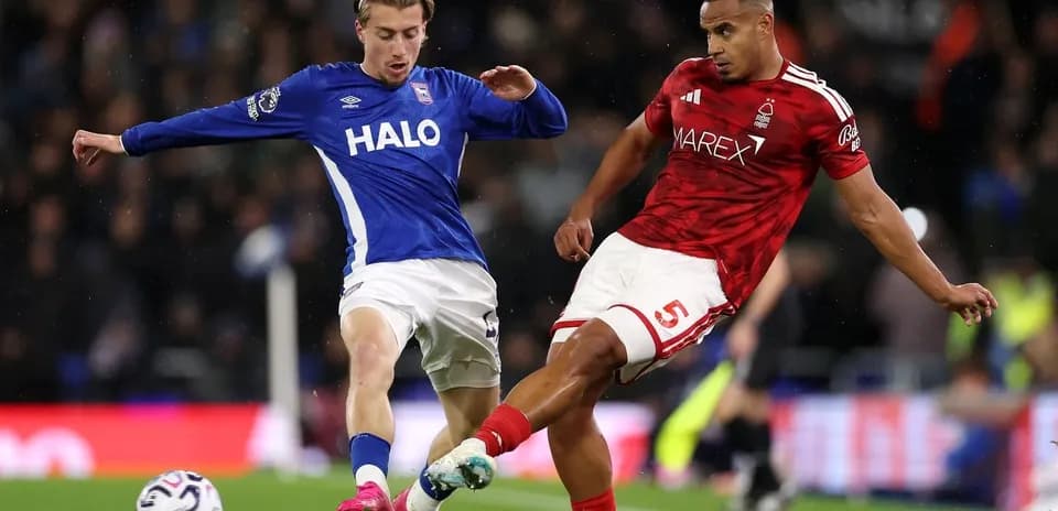 Two players contesting the ball during match action
