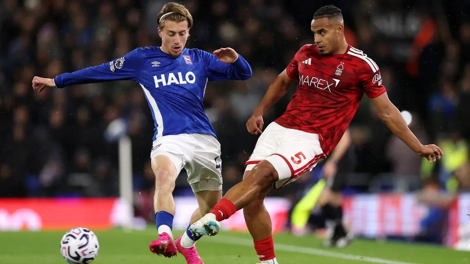 Two players contesting the ball during match action