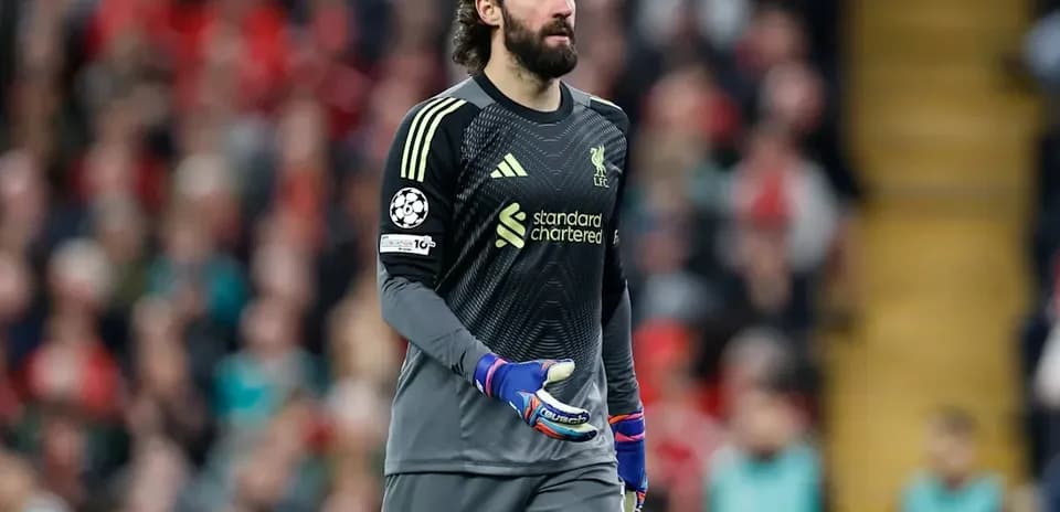 Goalkeeper walking on pitch during match
