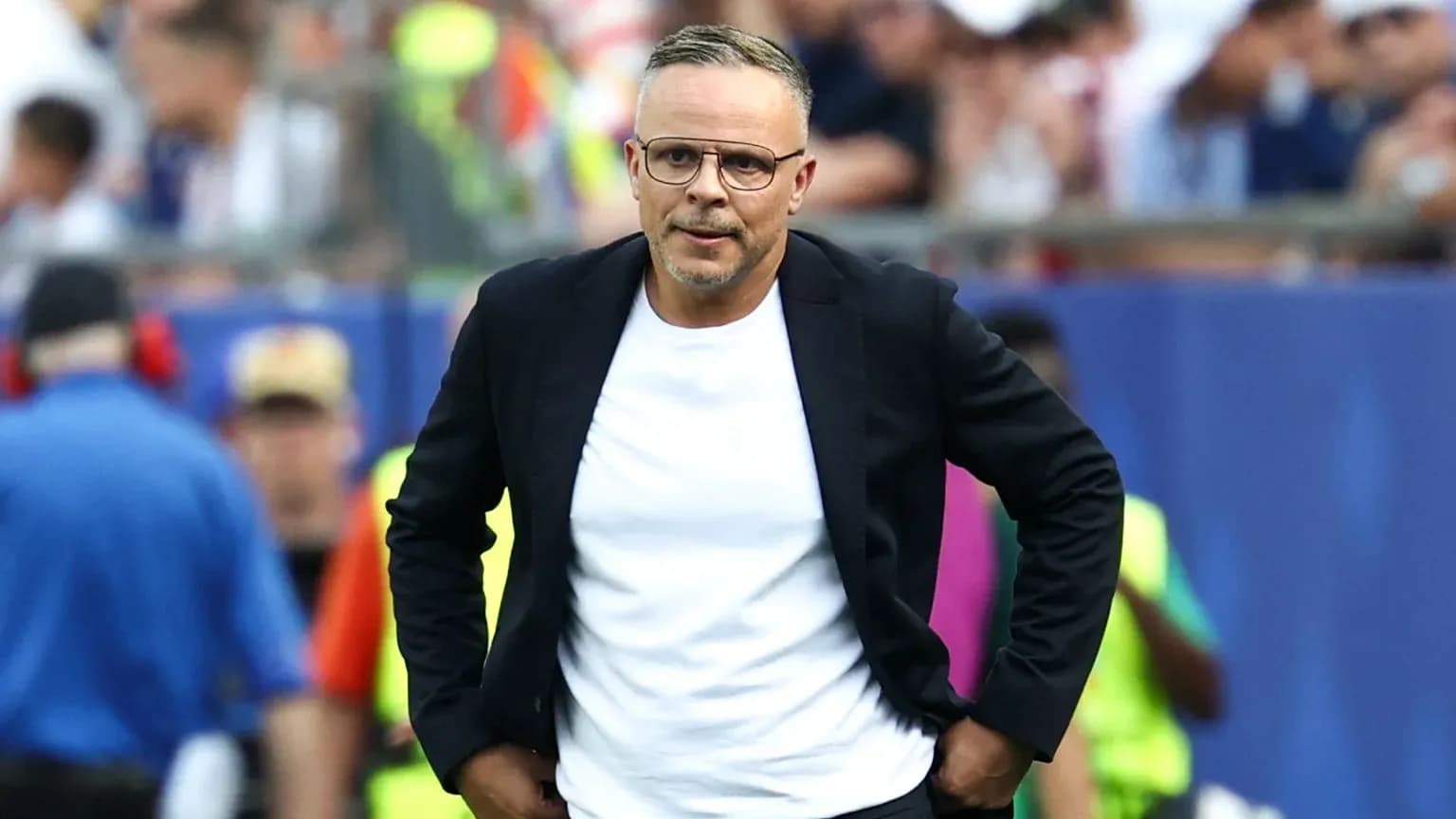 Coach walking on the sideline during a match