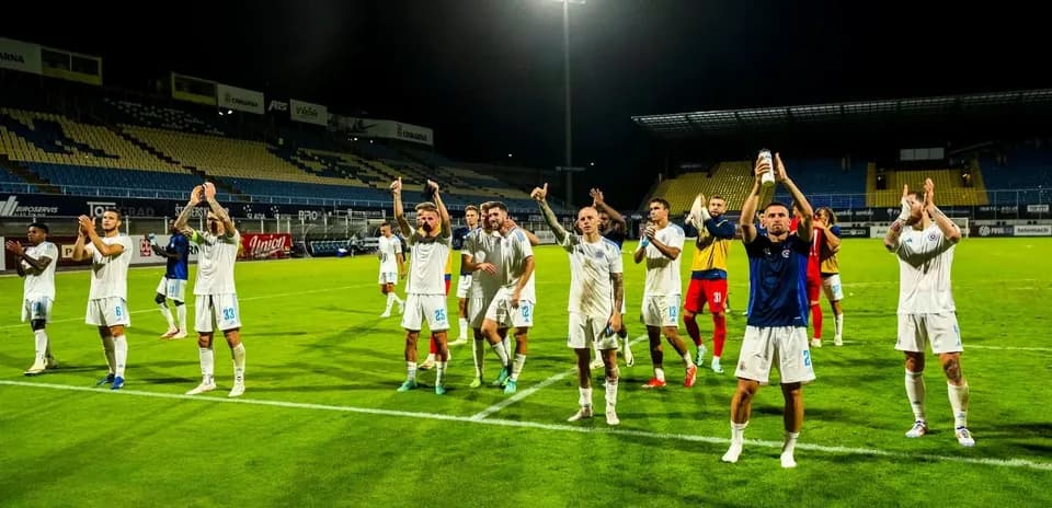 Players celebrating after the match victory