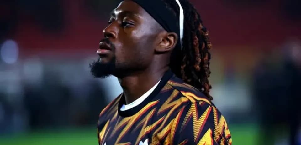 Player in colorful kit during warm-up before match