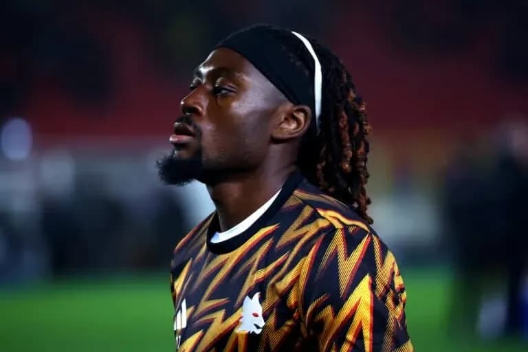 Player in colorful kit during warm-up before match